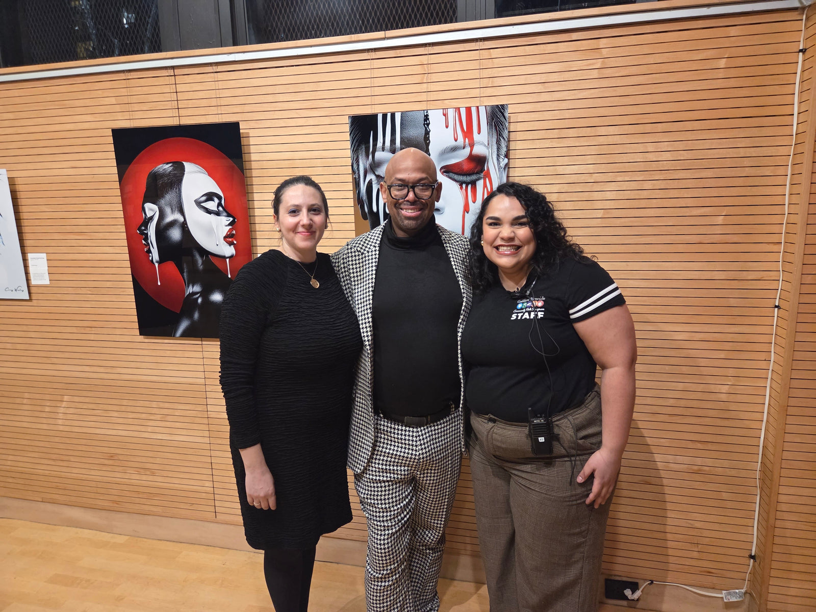 Corey Wesley with exhibition hosts Manon and Eva of Goddard Riverside during the opening of Unapologetic Faces: The Cost of Being Seen in New York City.