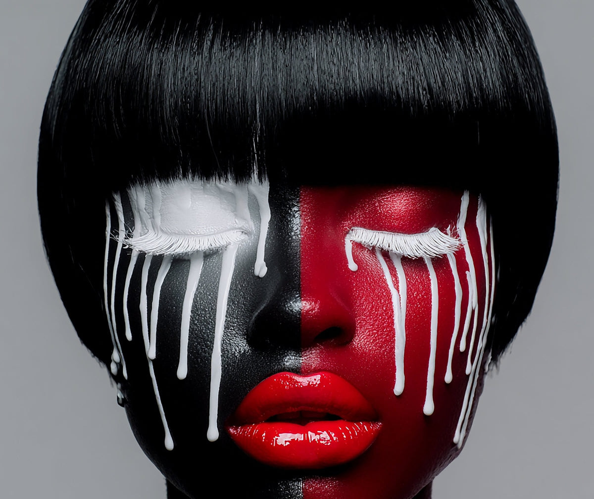 Burning Desire by Corey Wesley. A face with a black bob, split black and red, white paint dripping from closed eyes, red lips.