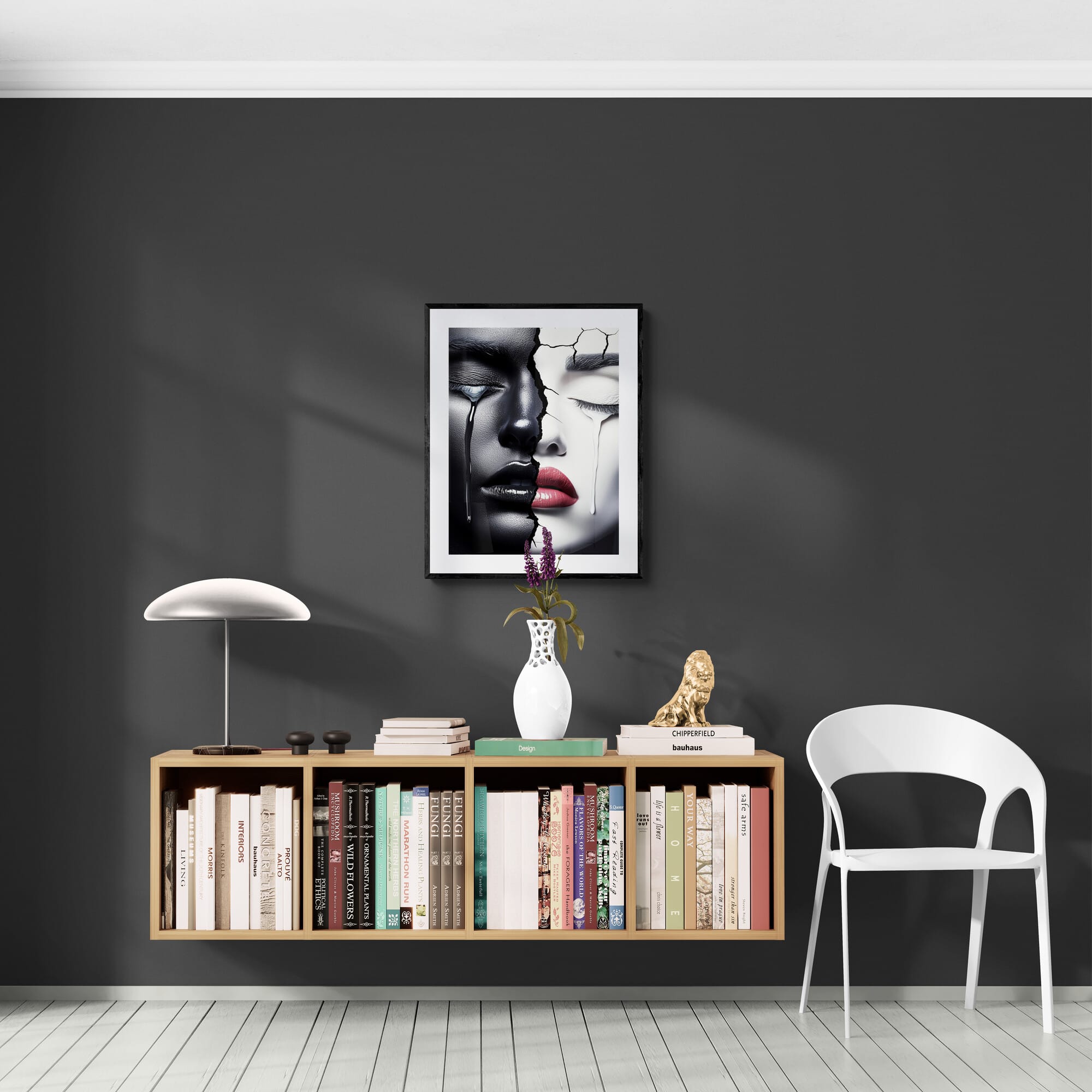 Modern framed African-American canvas art, "Duality of Tears," on dark wall above bookshelf and white chair, highlighting Afrocentric home decor.