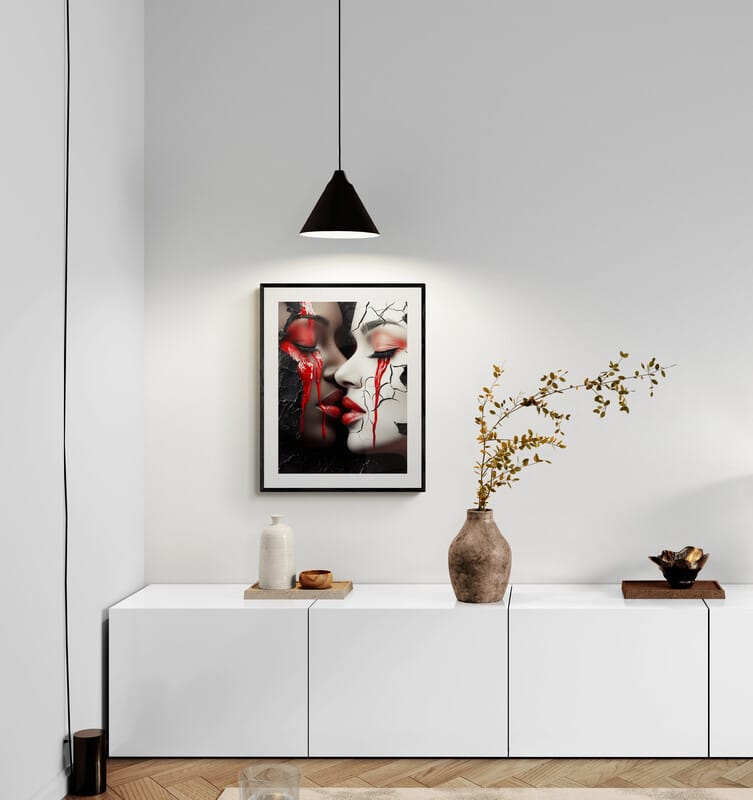 Embrace of Shadows and Light - Abstract African-American framed print hanging in a modern living room, showcasing bold contrasting faces and vivid red accents.