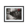 Black and white urban photo of a bicycle with red flowers, framed wall art for modern spaces and African-American home decor.