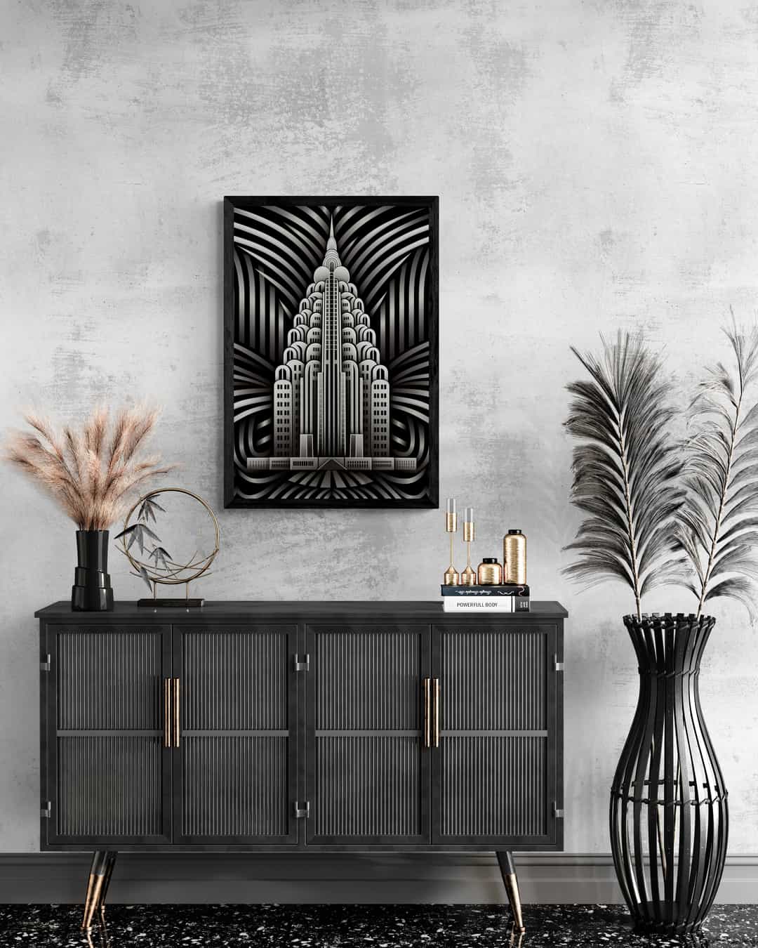 Monochrome art deco artwork by Milton Wes Art, featuring an elegant, symmetrical skyscraper design, hanging above a contemporary sideboard with decorative vases and dried grass accents in a chic, textured room.