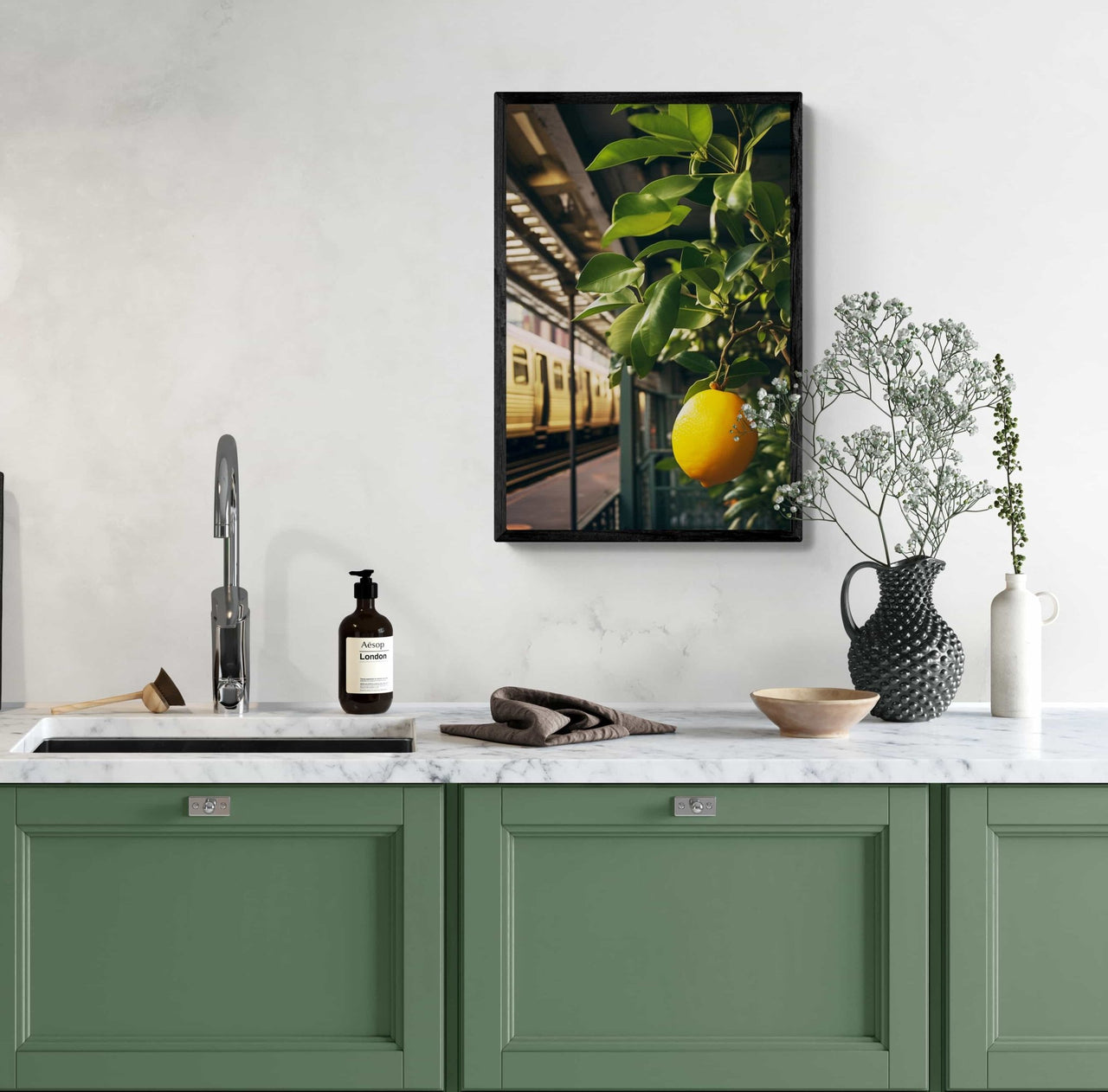 A framed poster print from Milton Wes Art, featuring a bright lemon on a tree branch with a subway train in the background, hung on a kitchen wall, adding a fresh and urban vibe to the culinary space.